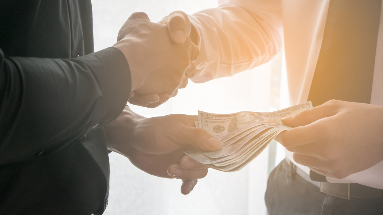 professionals exchange money