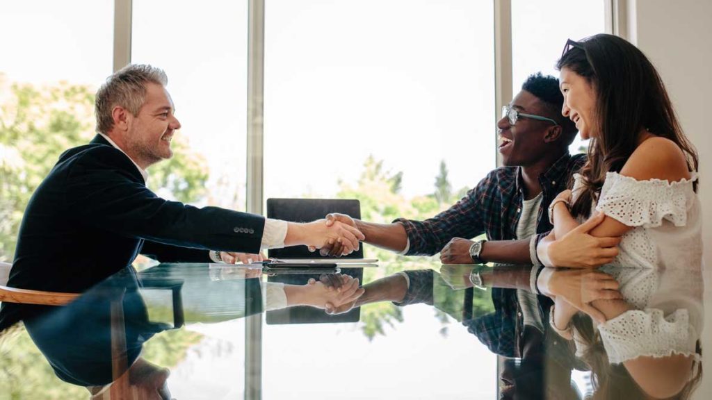 attorney shaking hands with client